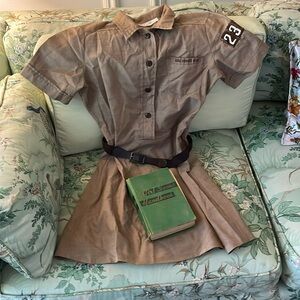 Vintage Girl Scout outfit with hardback vintage handbook